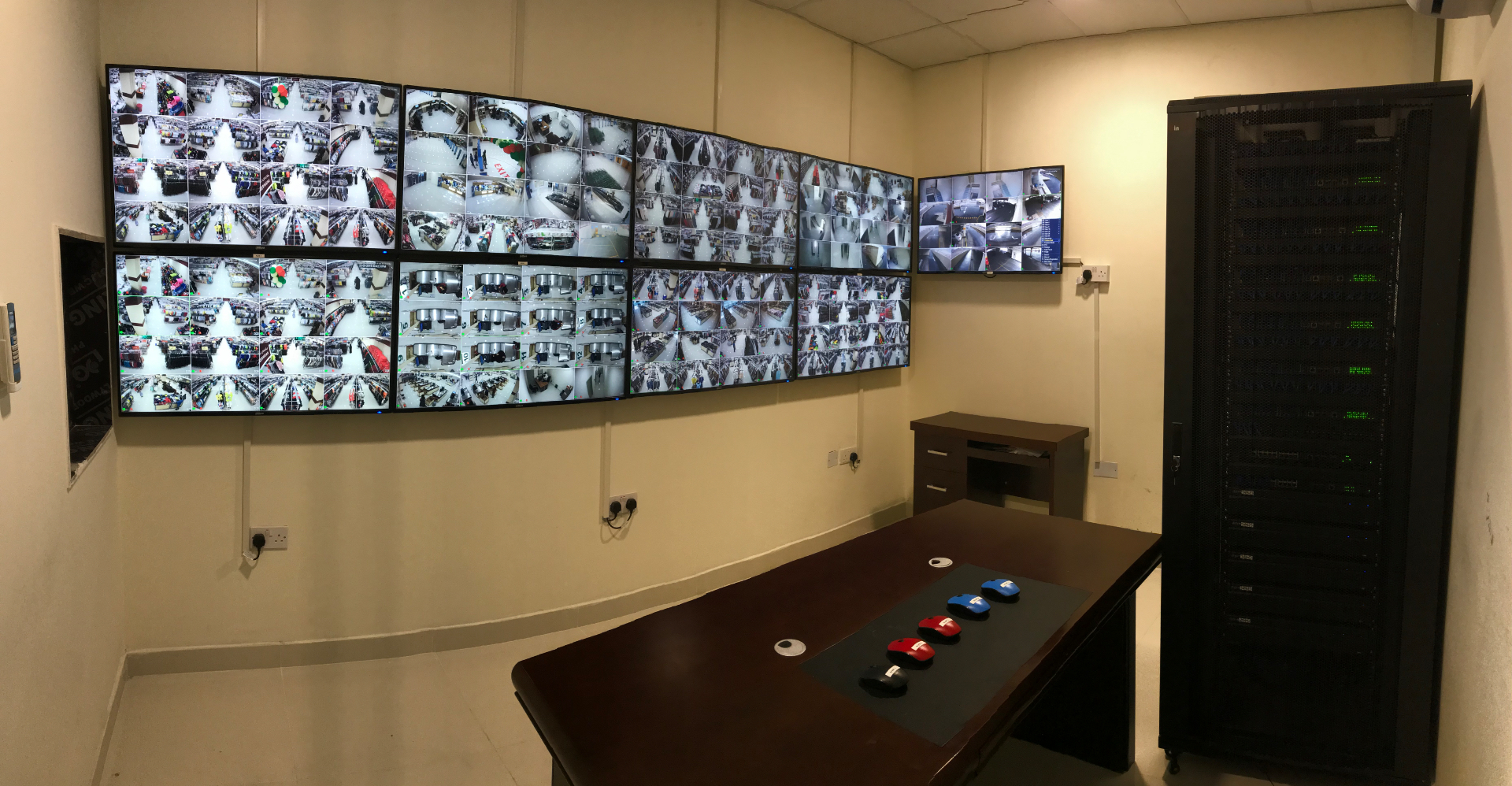 Modern smart-city control room with a curved video wall of CCTV feeds